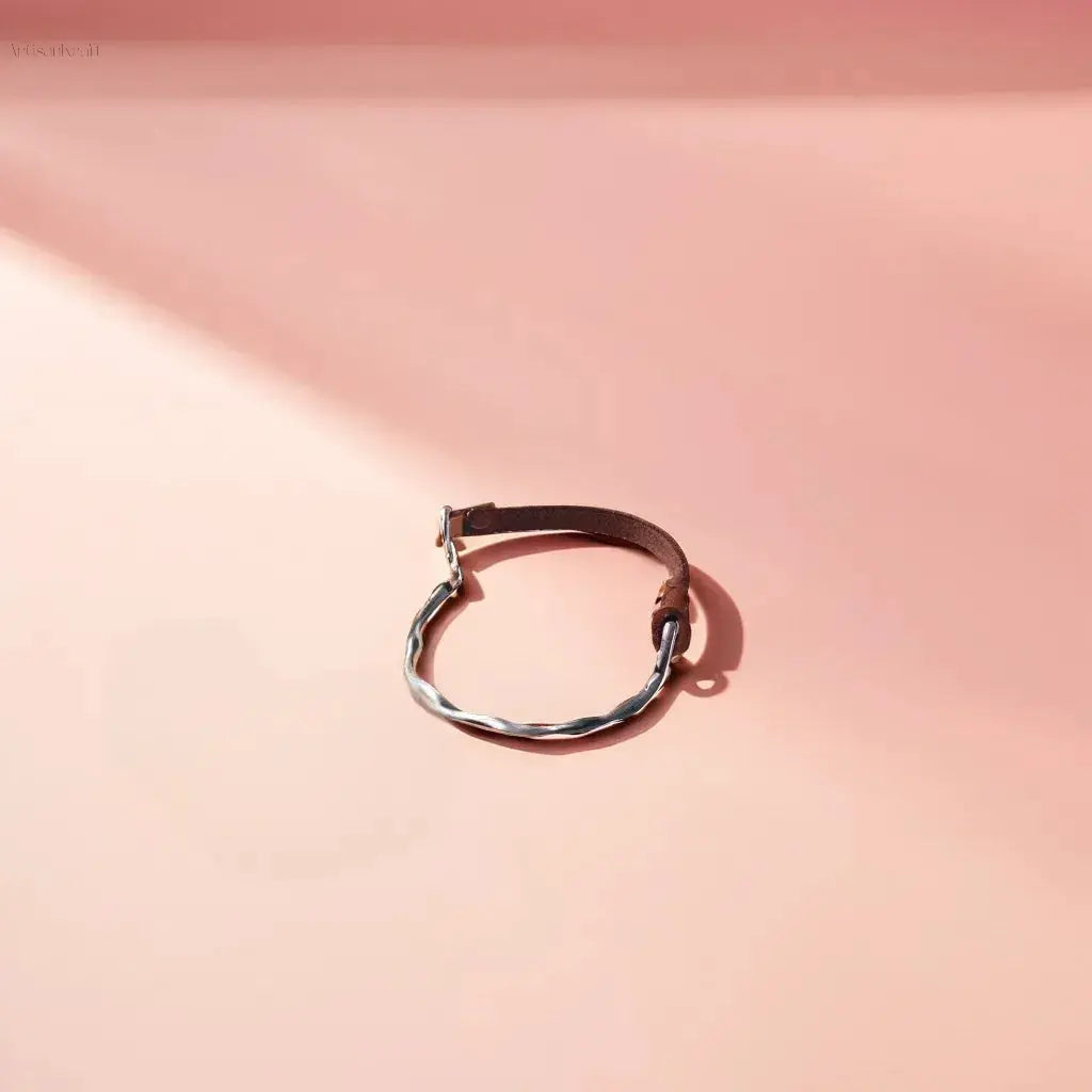 Handcrafted gold and leather bracelet with silver-plated zircon charm, stylish and durable for all occasions
