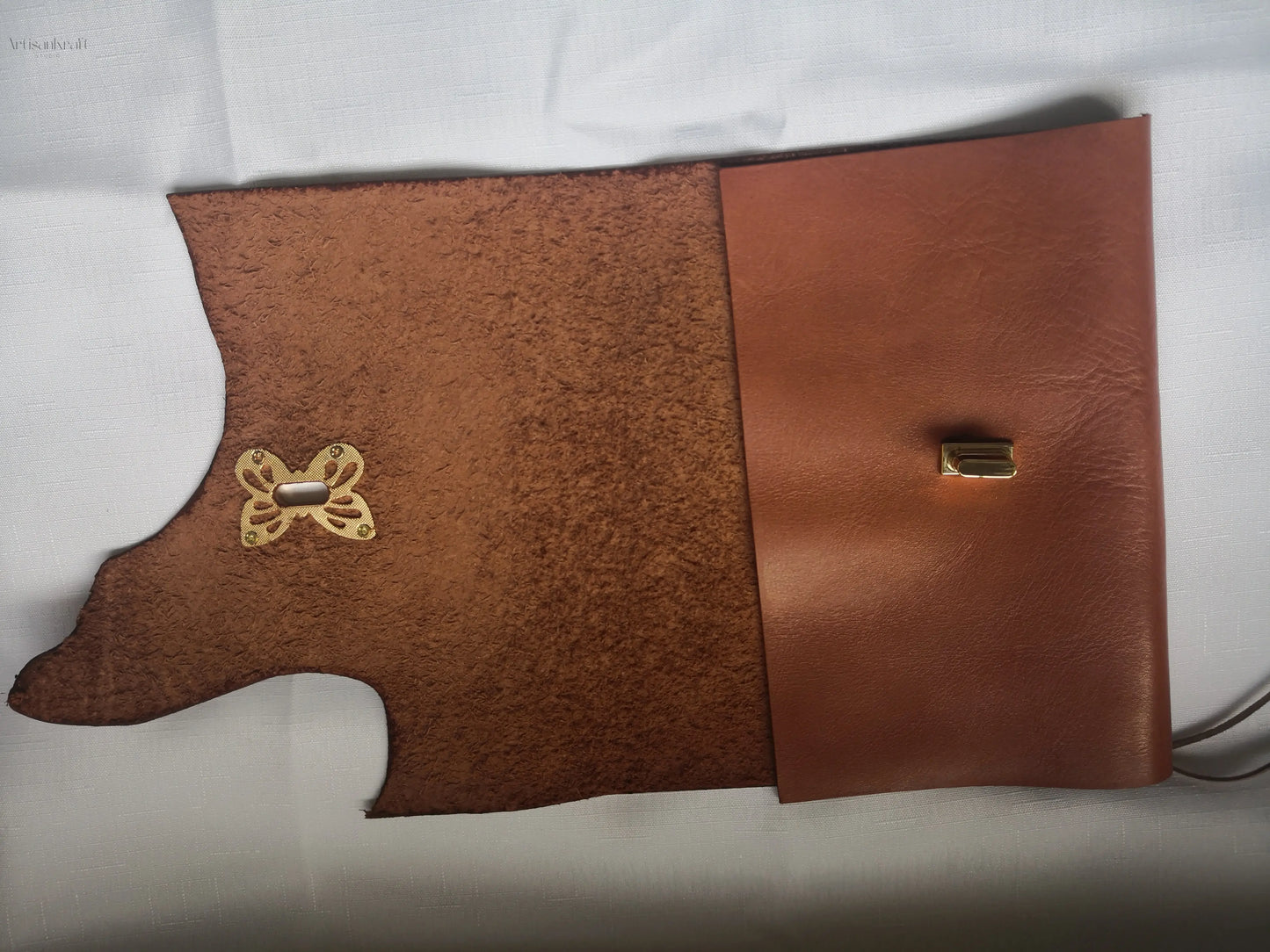 Handcrafted leather journal with wasp clasp, perfect for travel writing and gifting