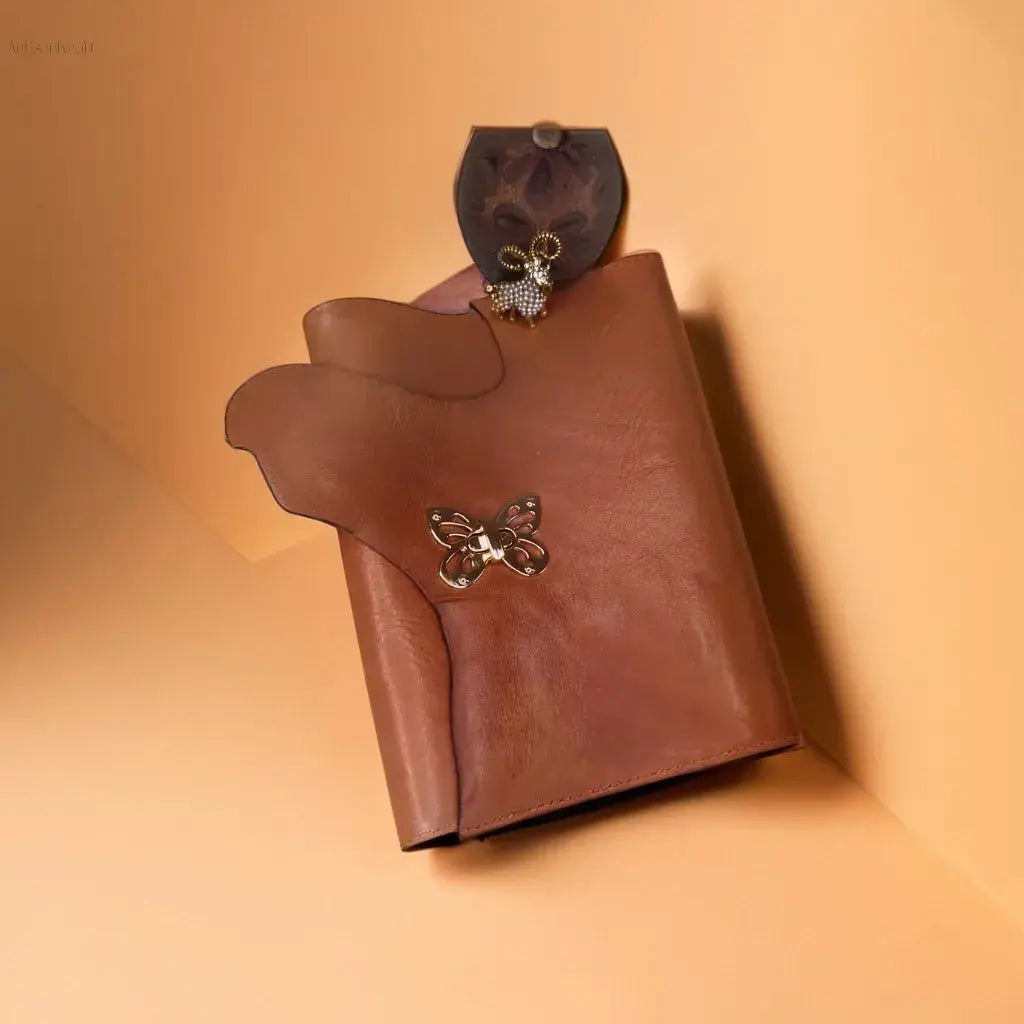 Handmade leather journal with gold butterfly clasp, perfect for gifts and travel