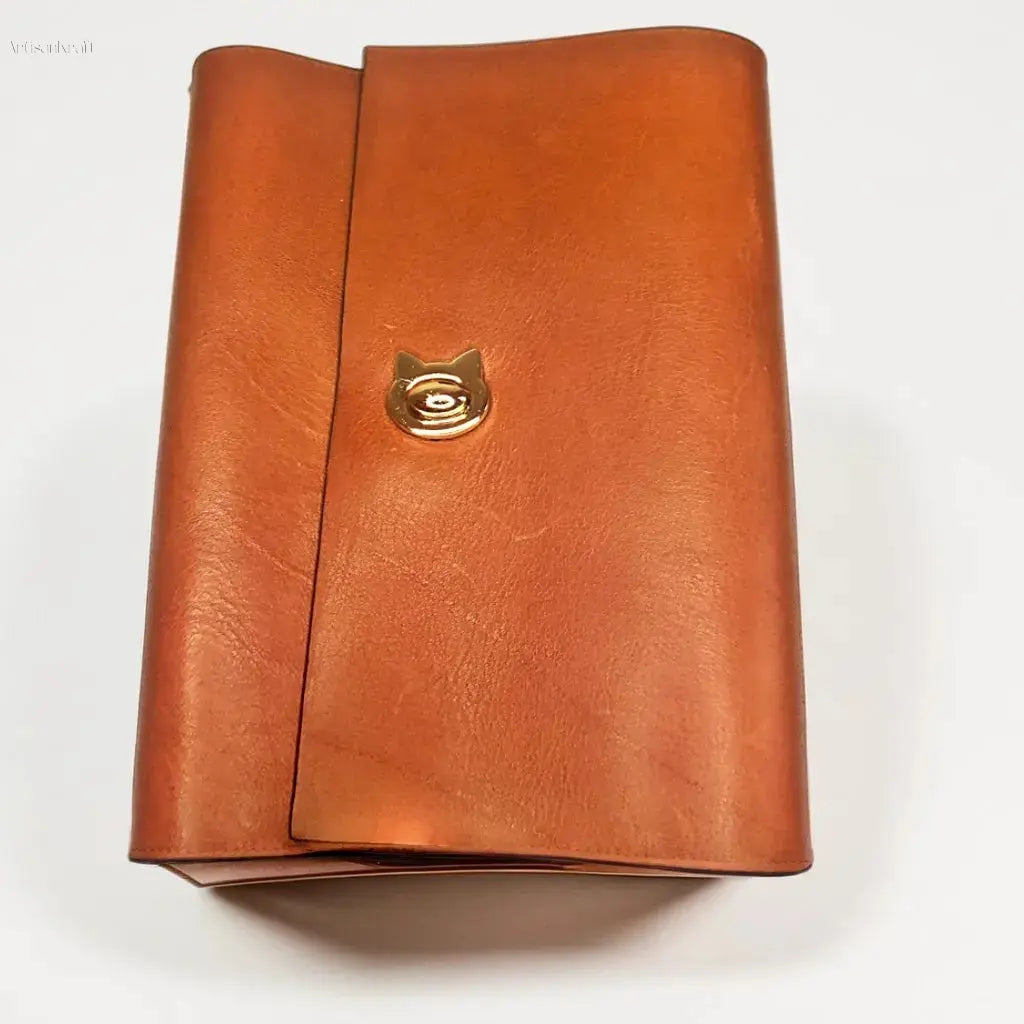 Handcrafted leather journal with a stylish cat clasp, perfect for creative writing or gifting