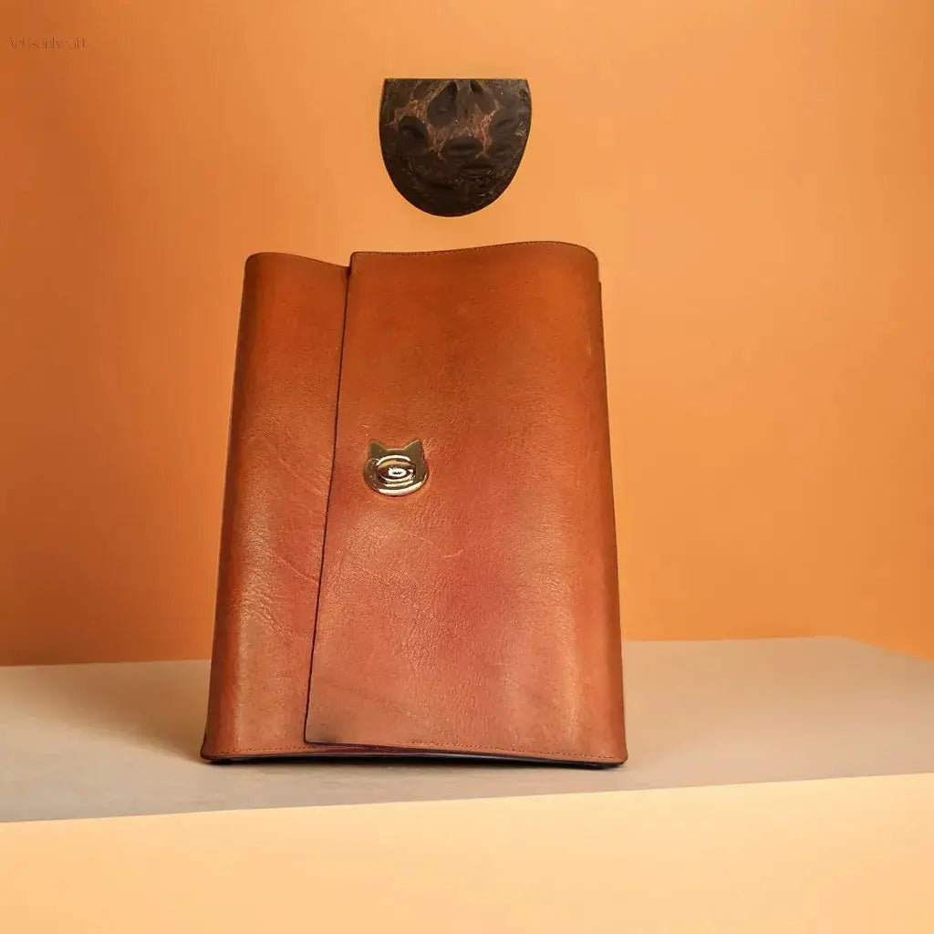 Handcrafted leather journal with a stylish cat clasp, perfect for creative writing or gifting