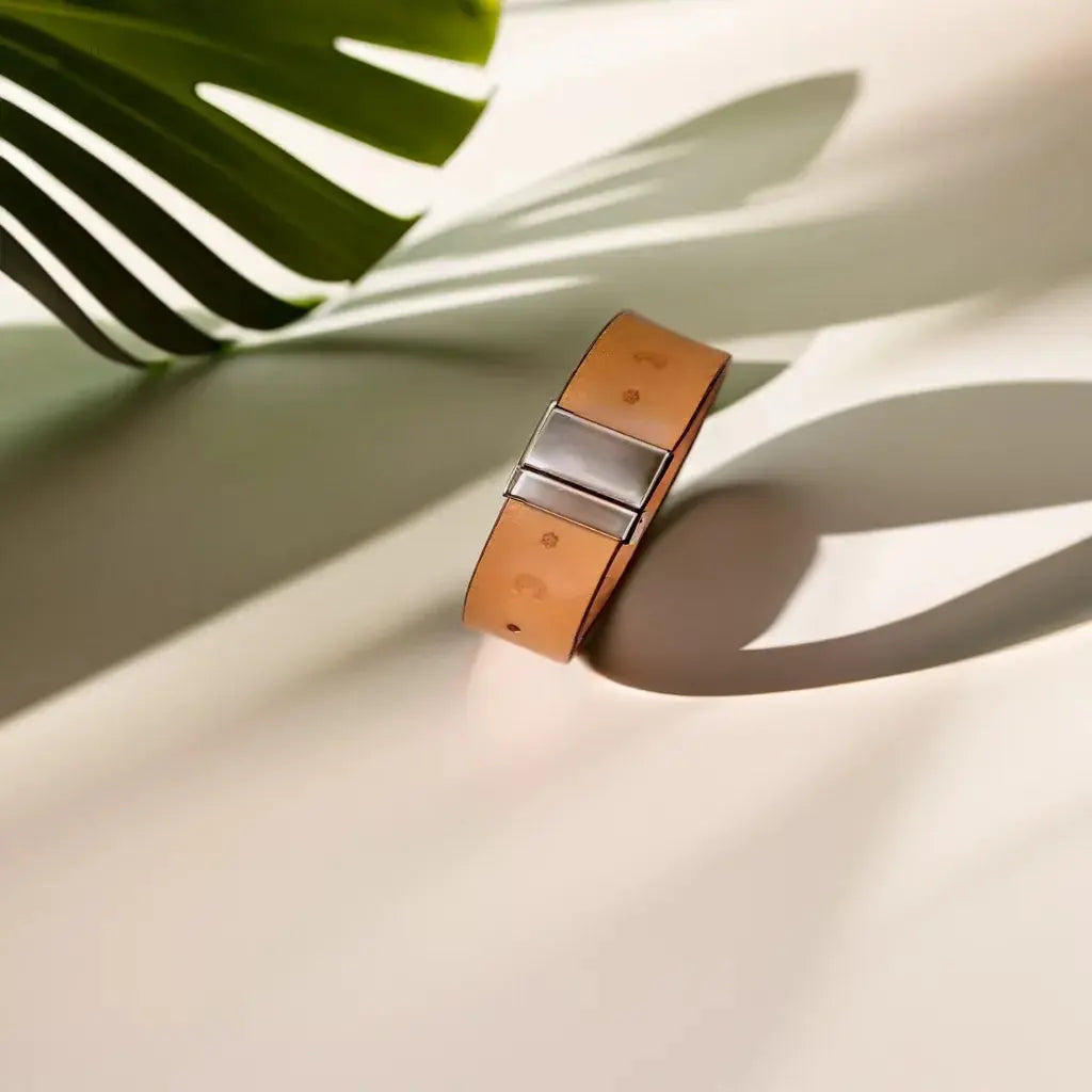 Hand-tooled leather bracelet in natural tan with flower-stamped design, perfect for gifting or daily wear