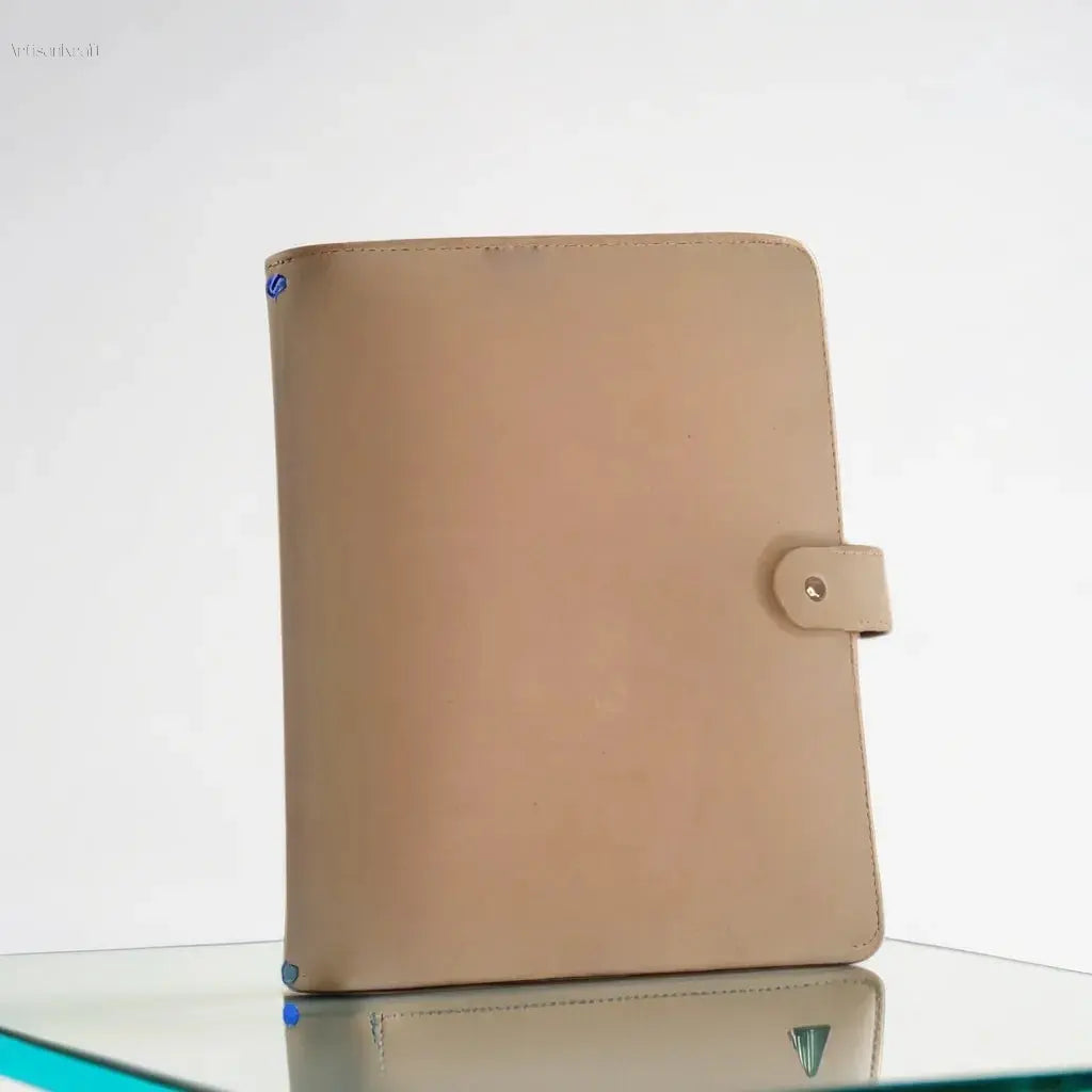 Minimalist handcrafted leather journal cover in beige, perfect for creative writing or professional notes