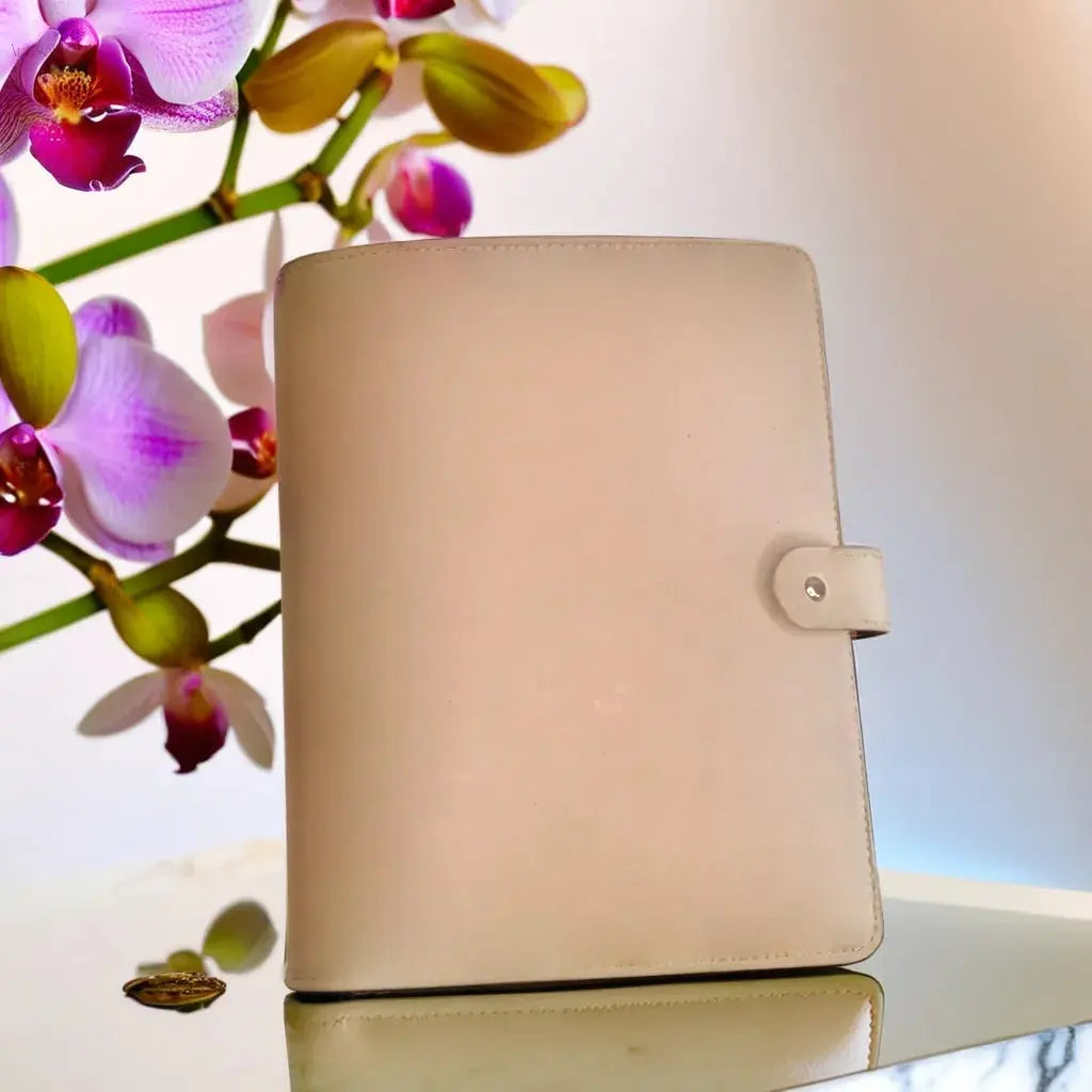 Minimalist handcrafted leather journal cover in beige, perfect for creative writing or professional notes